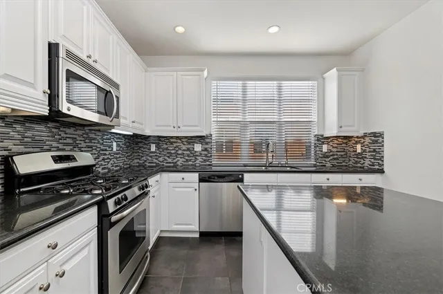 a bathroom with a sink a mirror and shower