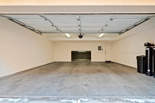 a view of a park with a house in the background