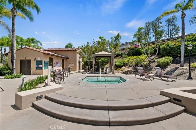 a living room with furniture a table and a large window