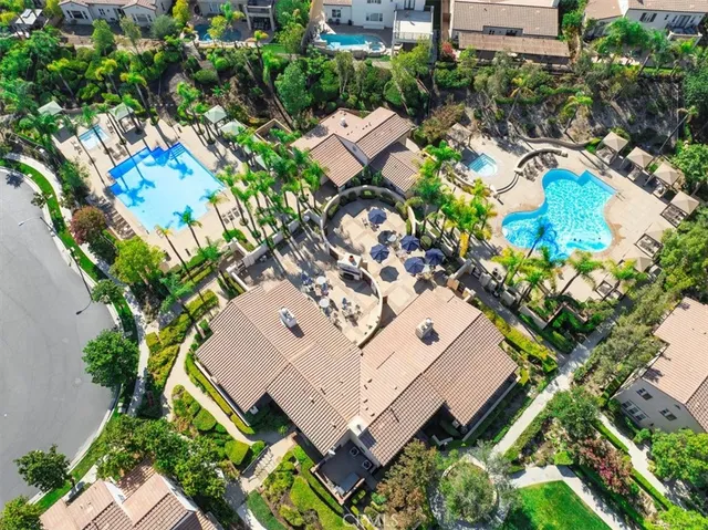 a view of a swimming pool with a table and chairs