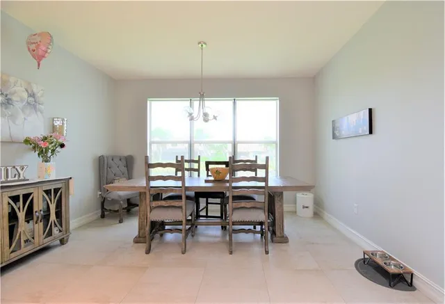 a kitchen with kitchen island granite countertop stainless steel appliances cabinets a sink and a counter top space