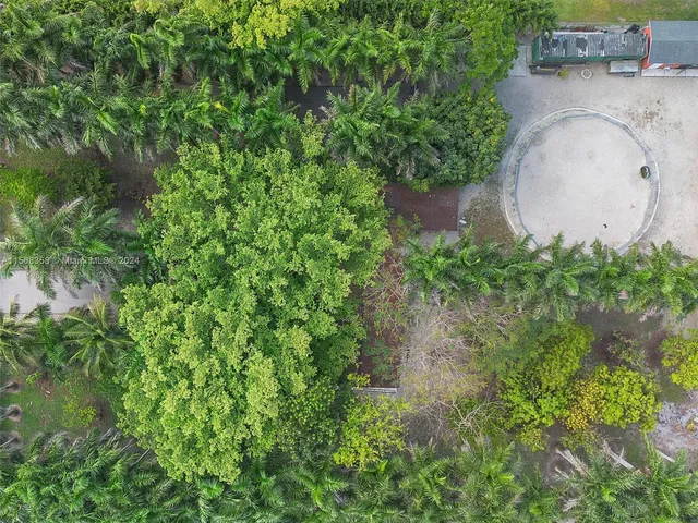 an aerial view of a house with outdoor space