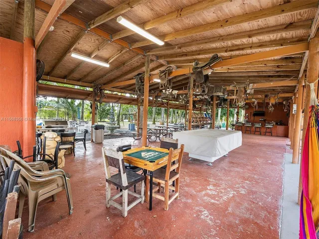 a view of a cars park in front of a building