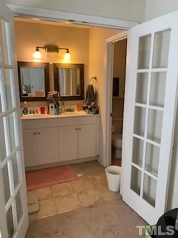 a view of a bathroom with a sink and mirror