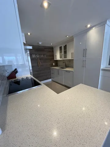 a large bedroom with a bed and a large mirror