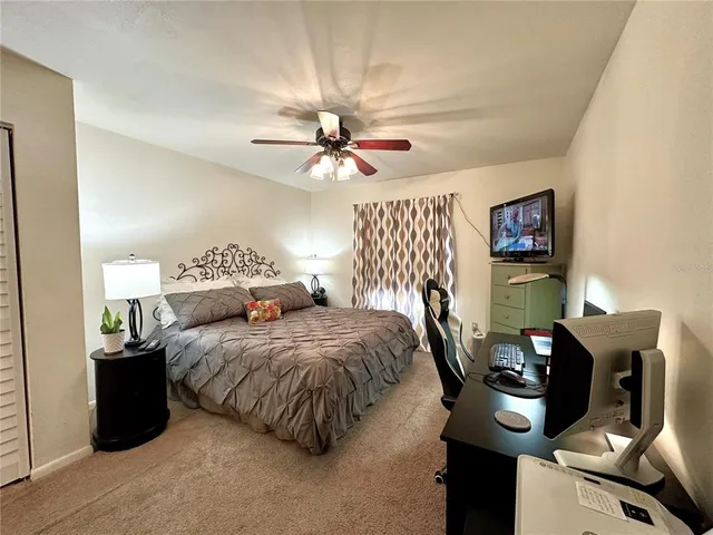 a bedroom with furniture and a chandelier