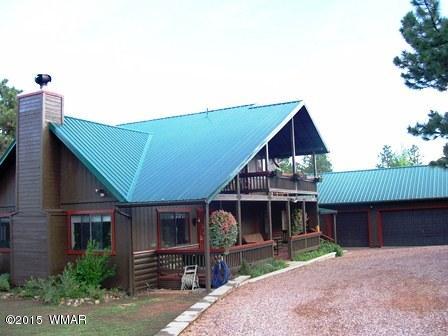 2849 Lodgepole Road Overgaard, AZ 85933 - Photo 54 of 67 a front view of a house with garden