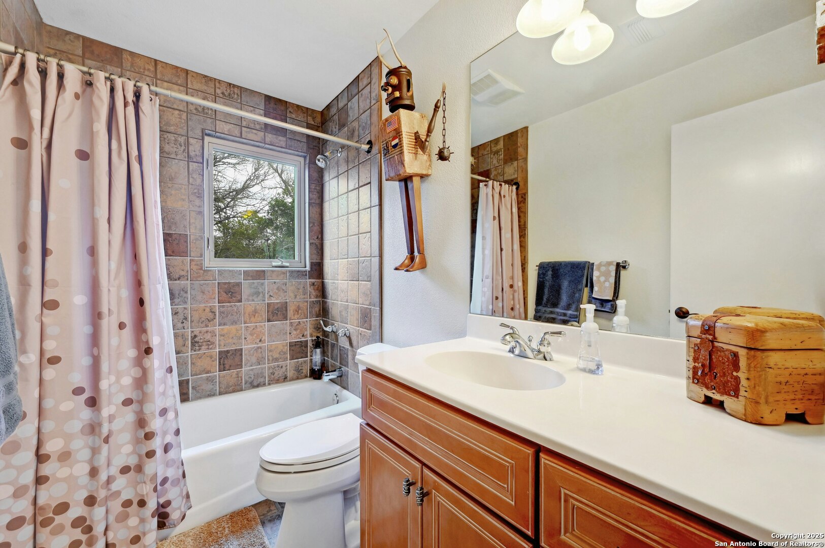 2147 Tejas Trail Blanco, TX 78606 - Photo 22 of 33 a bathroom with a sink a toilet tub and shower