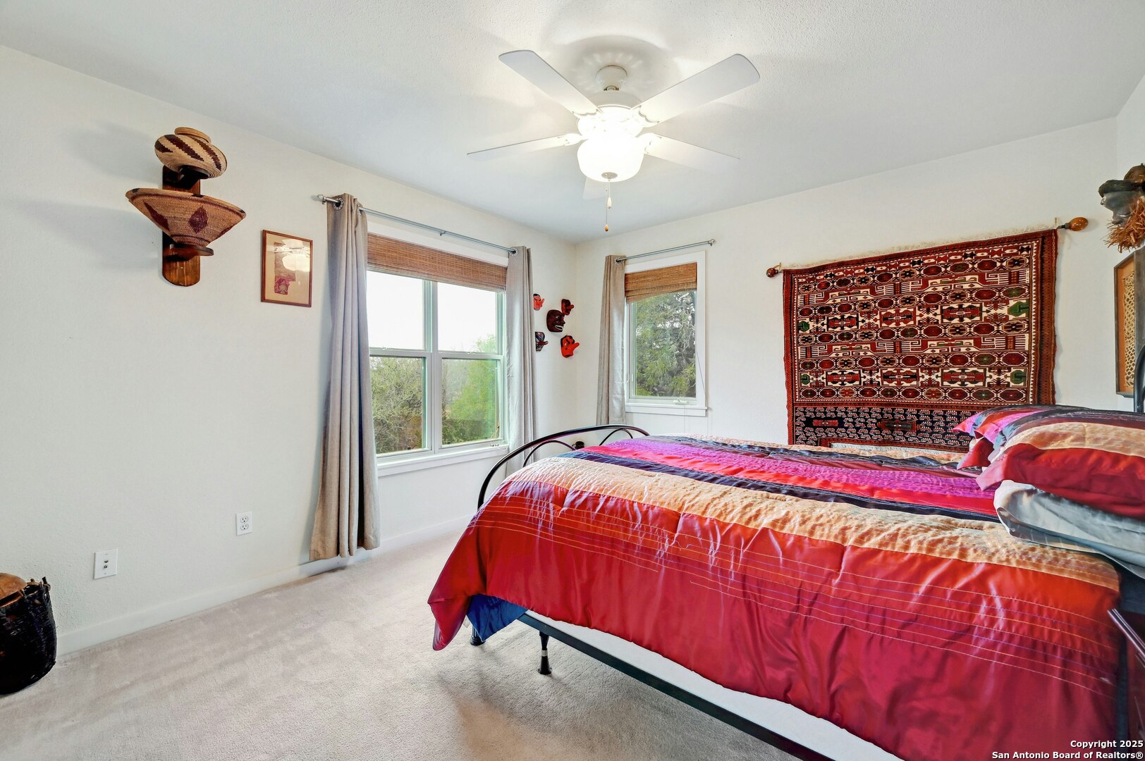2147 Tejas Trail Blanco, TX 78606 - Photo 23 of 33 a bed sitting in a bedroom next to a window
