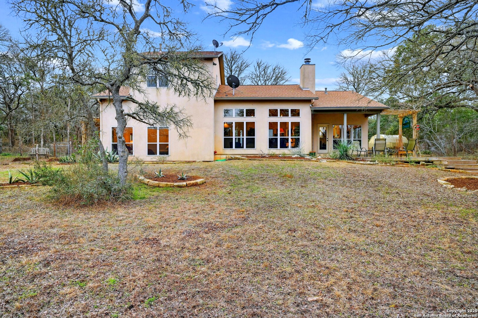 2147 Tejas Trail Blanco, TX 78606 - Photo 27 of 33 a front view of a house with a yard