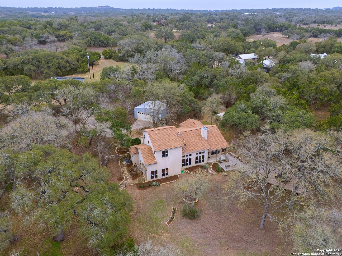 2147 Tejas Trail Blanco, TX 78606 - Photo 32 of 33 an aerial view of a house with a field