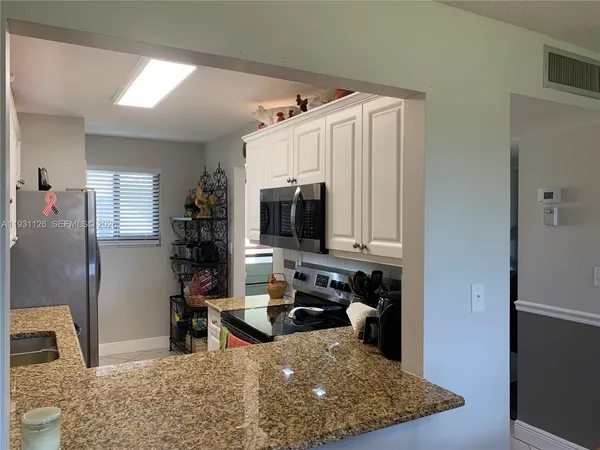 a view of a living room and bathroom