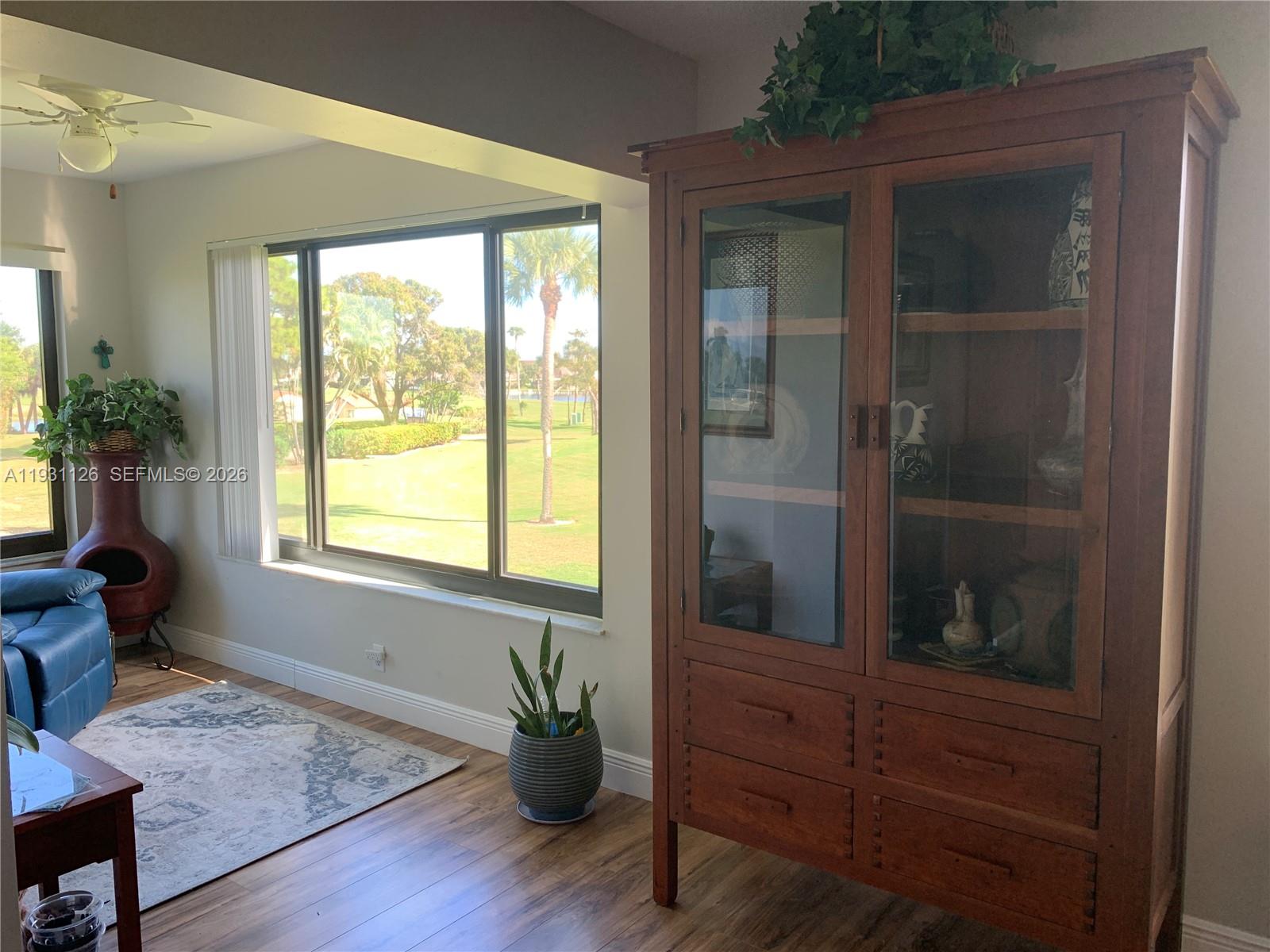 5463 Southeast Miles Grant Road, Unit 210 Stuart, FL 34997 - Photo 23 of 53 a room with wooden door and furniture