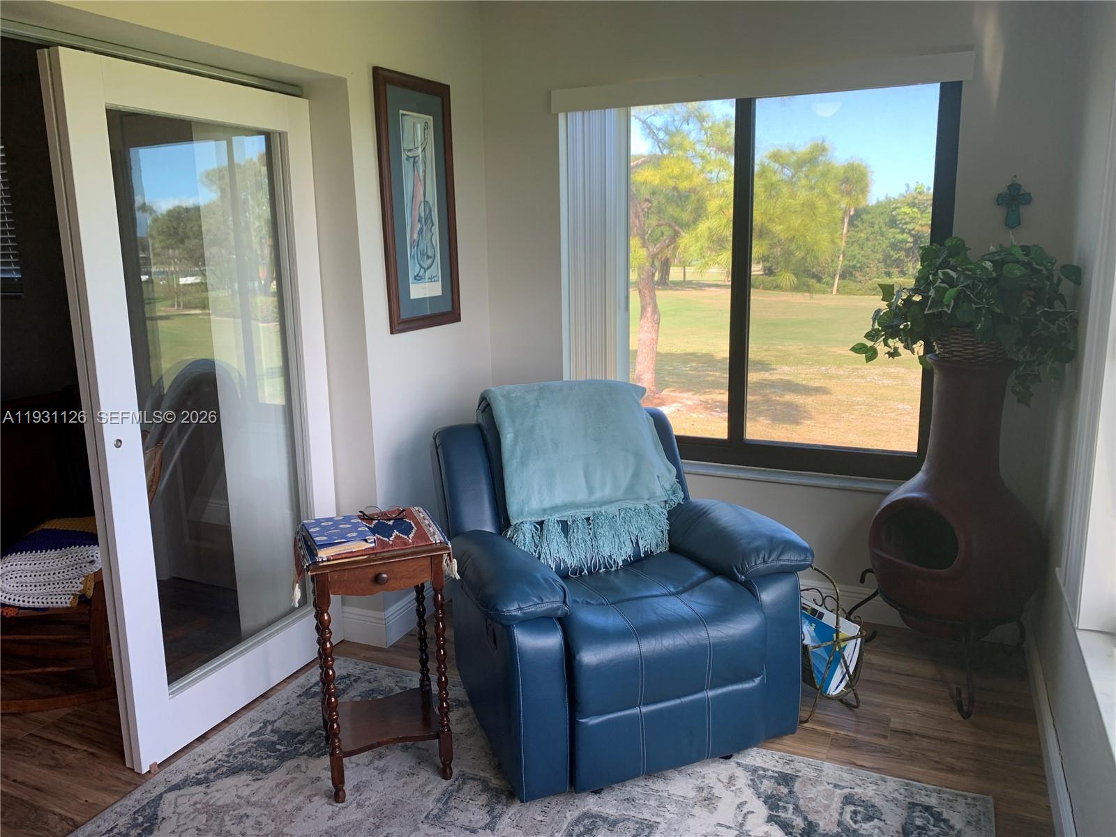 5463 Southeast Miles Grant Road, Unit 210 Stuart, FL 34997 - Photo 27 of 53 a living room with furniture and a window