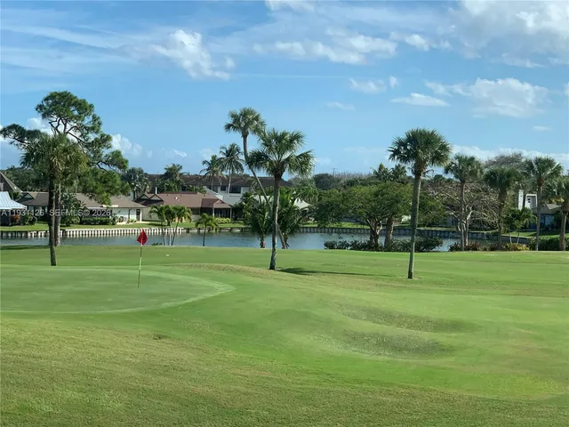 a view of a park with swings and slides