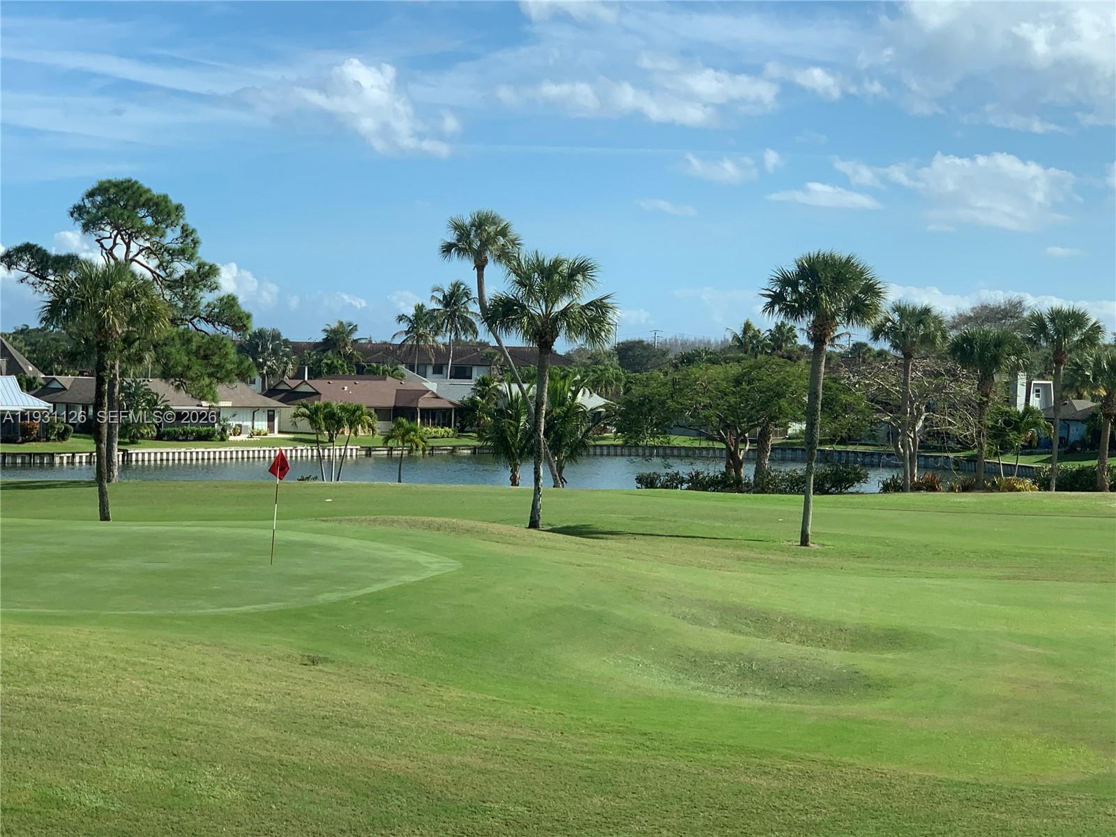 5463 Southeast Miles Grant Road, Unit 210 Stuart, FL 34997 - Photo 3 of 53 a view of a park with swings and slides