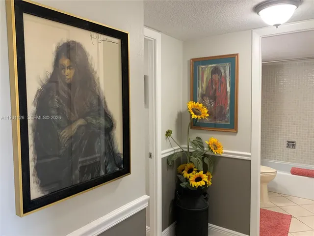 a bedroom with a bed and dresser