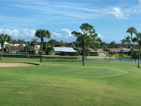 a front view of a house with a big yard