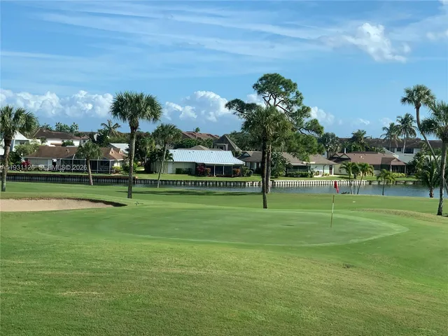 a front view of a house with a big yard