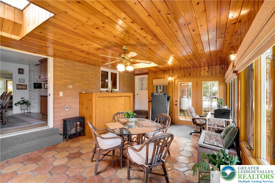 5747 Kernsville Road Orefield, PA 18069 - Photo 24 of 56 a view of a patio with table and chairs and potted plants