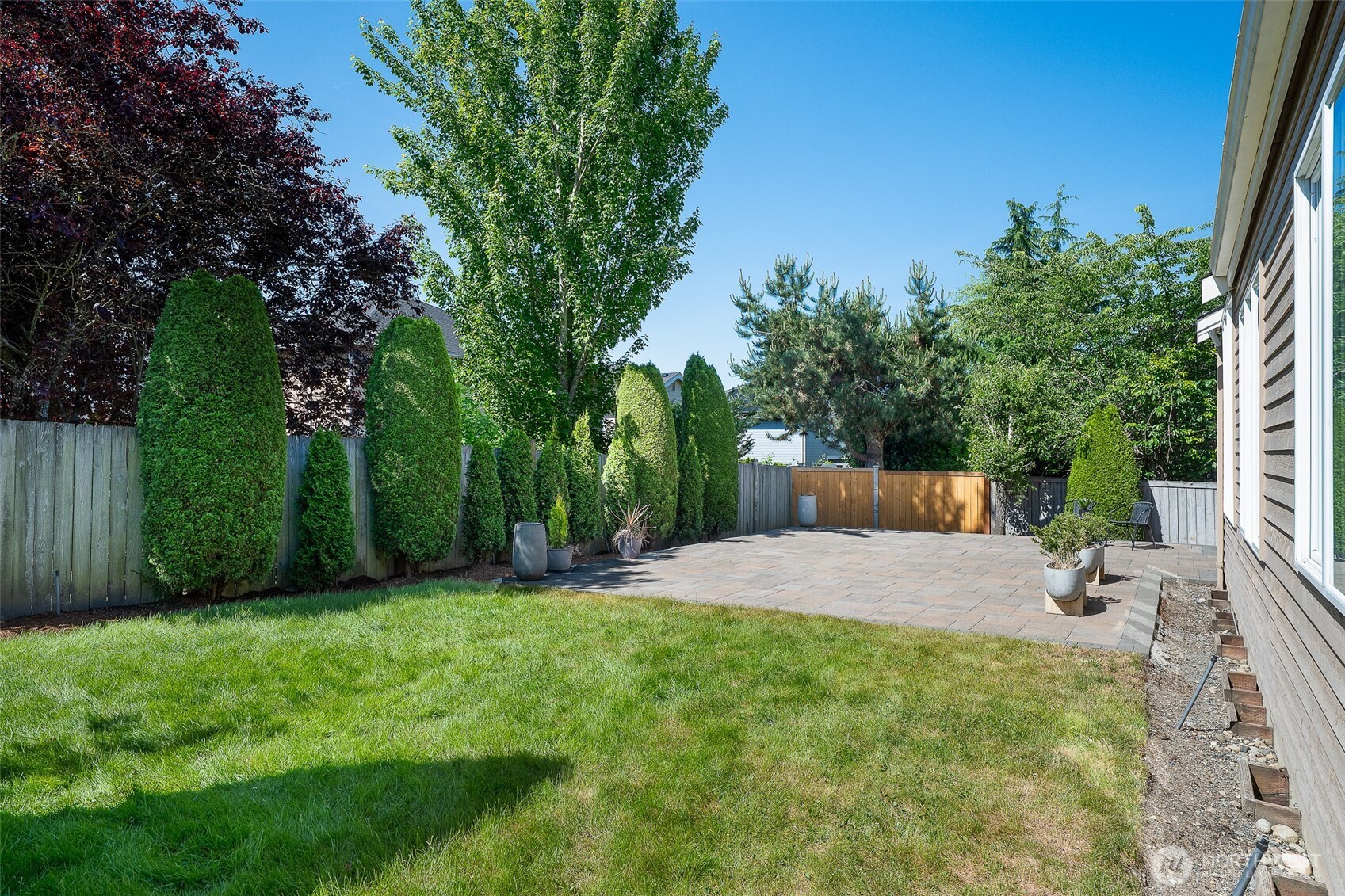 3932 221st Place Southeast Bothell, WA 98021 - Photo 33 of 36 a backyard of a house with lots of green space