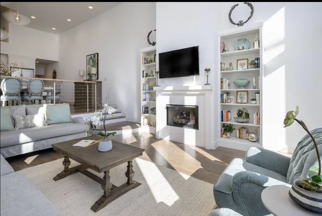 a kitchen with white cabinets sink and stainless steel appliances
