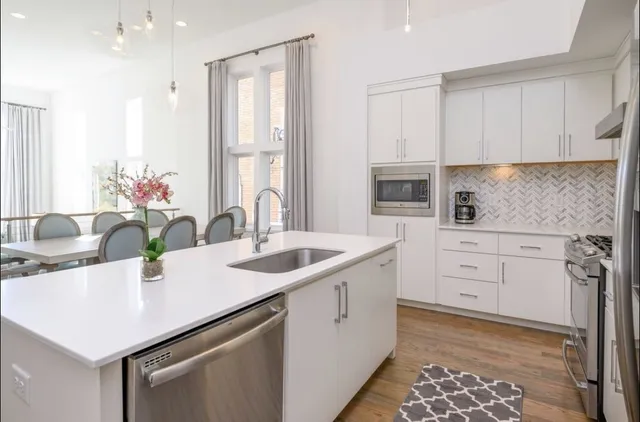 a spacious bedroom with a bed and a flat screen tv