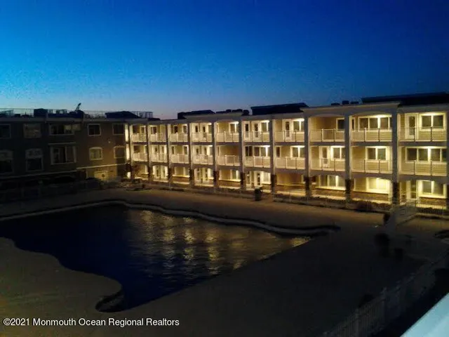 a view of swimming pool with outdoor seating