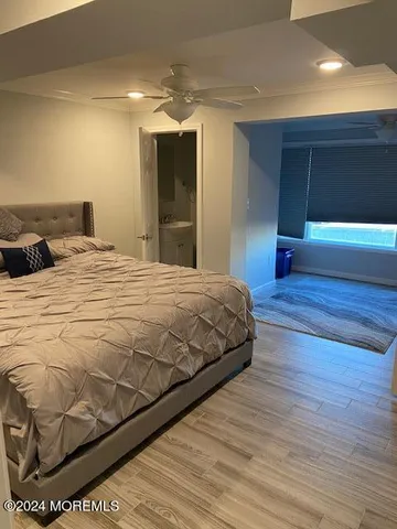 a bedroom with a bed and a view of bedroom