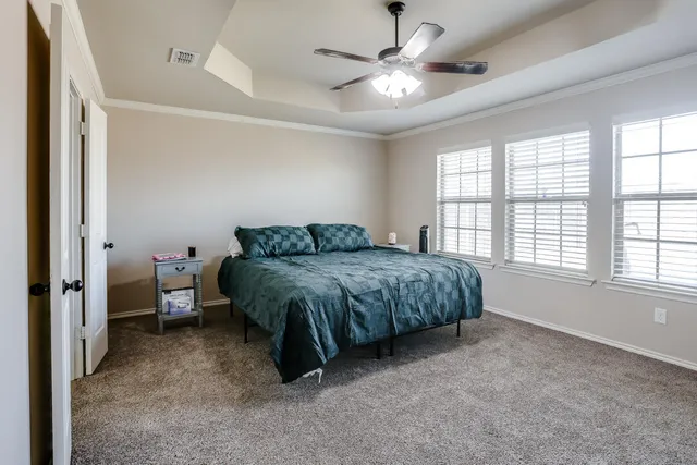 a large kitchen with a stove top oven and cabinets
