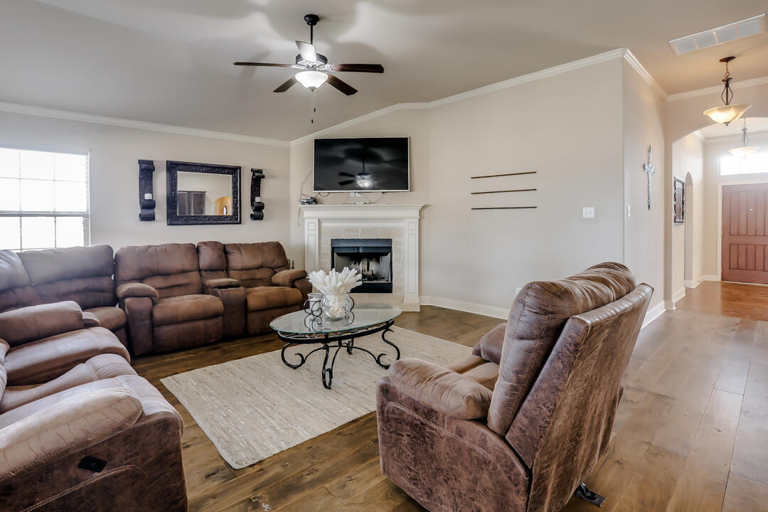 6502 71st Street Lubbock, TX 79424 - Photo 3 of 21 a living room with furniture fireplace and a window