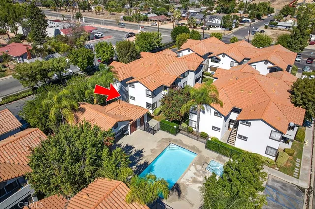 an aerial view of a houses with yard