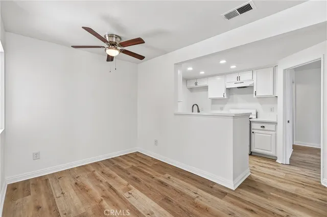 a view of kitchen with wooden floor