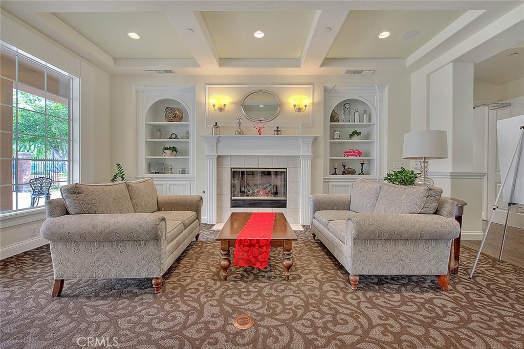 8150 West Preserve Loop Chino, CA 91708 - Photo 44 of 51 a living room with furniture and a fireplace