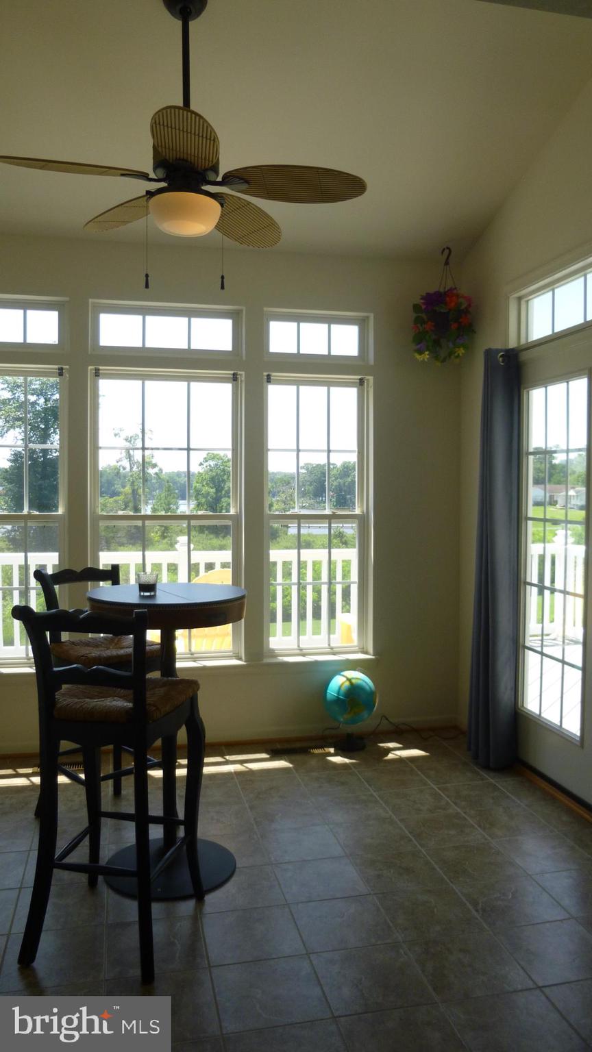 310 Monroe Point Drive Colonial Beach, VA 22443 - Photo 18 of 36 a view of a dining room with furniture window and outside view
