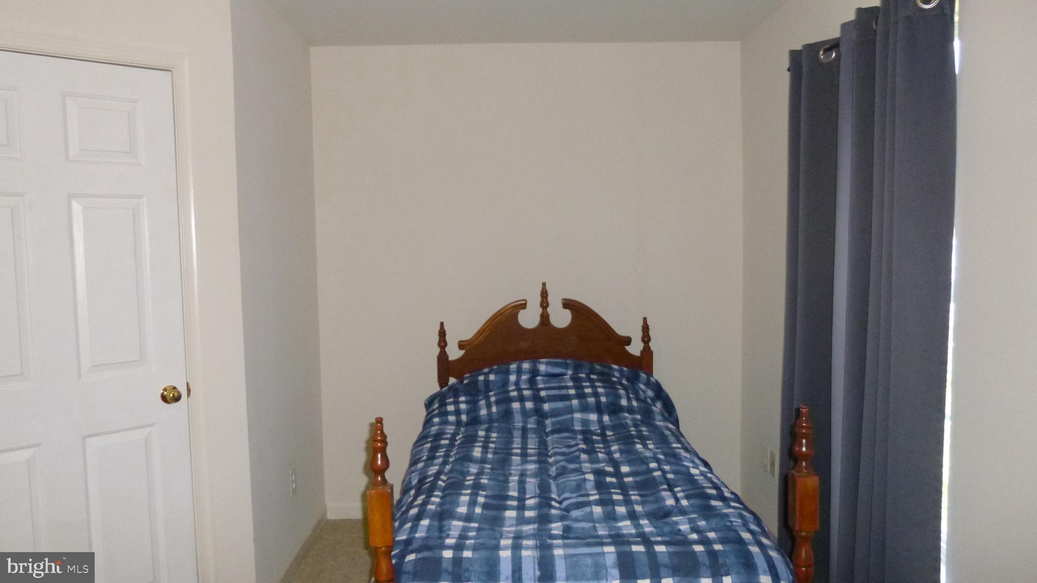 310 Monroe Point Drive Colonial Beach, VA 22443 - Photo 21 of 36 a walk in closet with wooden floor