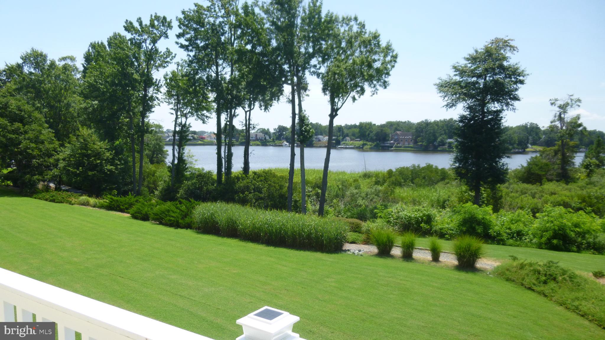 310 Monroe Point Drive Colonial Beach, VA 22443 - Photo 29 of 36 a view of a garden with a lake