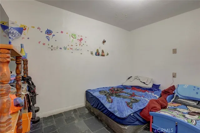 a bedroom with a bed and furniture