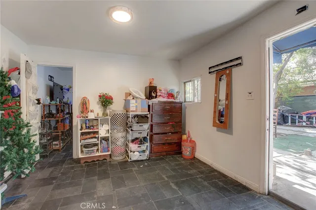 a view of a livingroom with storage and utility