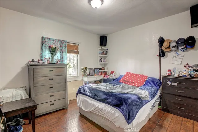 a bedroom with a bed and a dresser