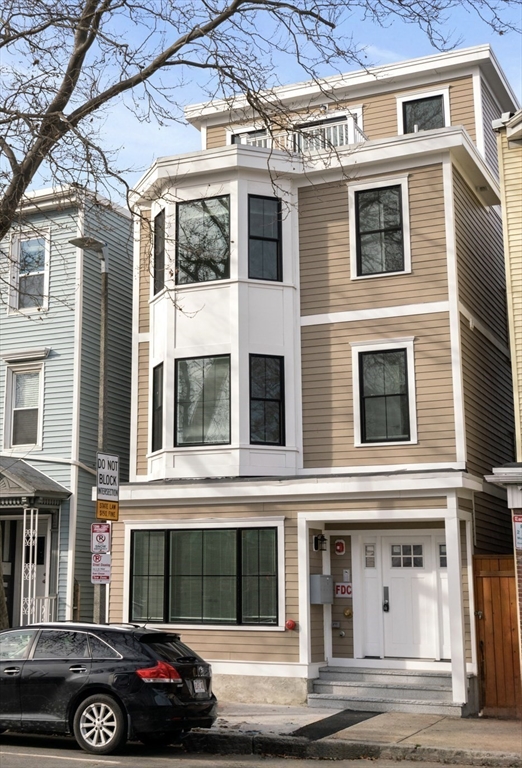 134 Chelsea Street, Unit 1 Boston, MA 02128 - Photo 8 of 13 a building that has a sign on it