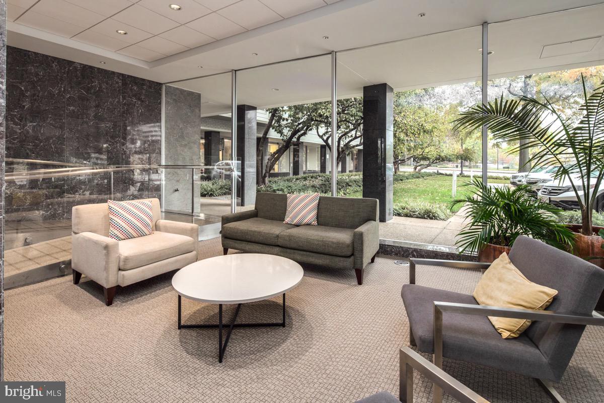 2475 Virginia Avenue Northwest, Unit 930 Washington, DC 20037 - Photo 28 of 42 a living room with furniture and a large window
