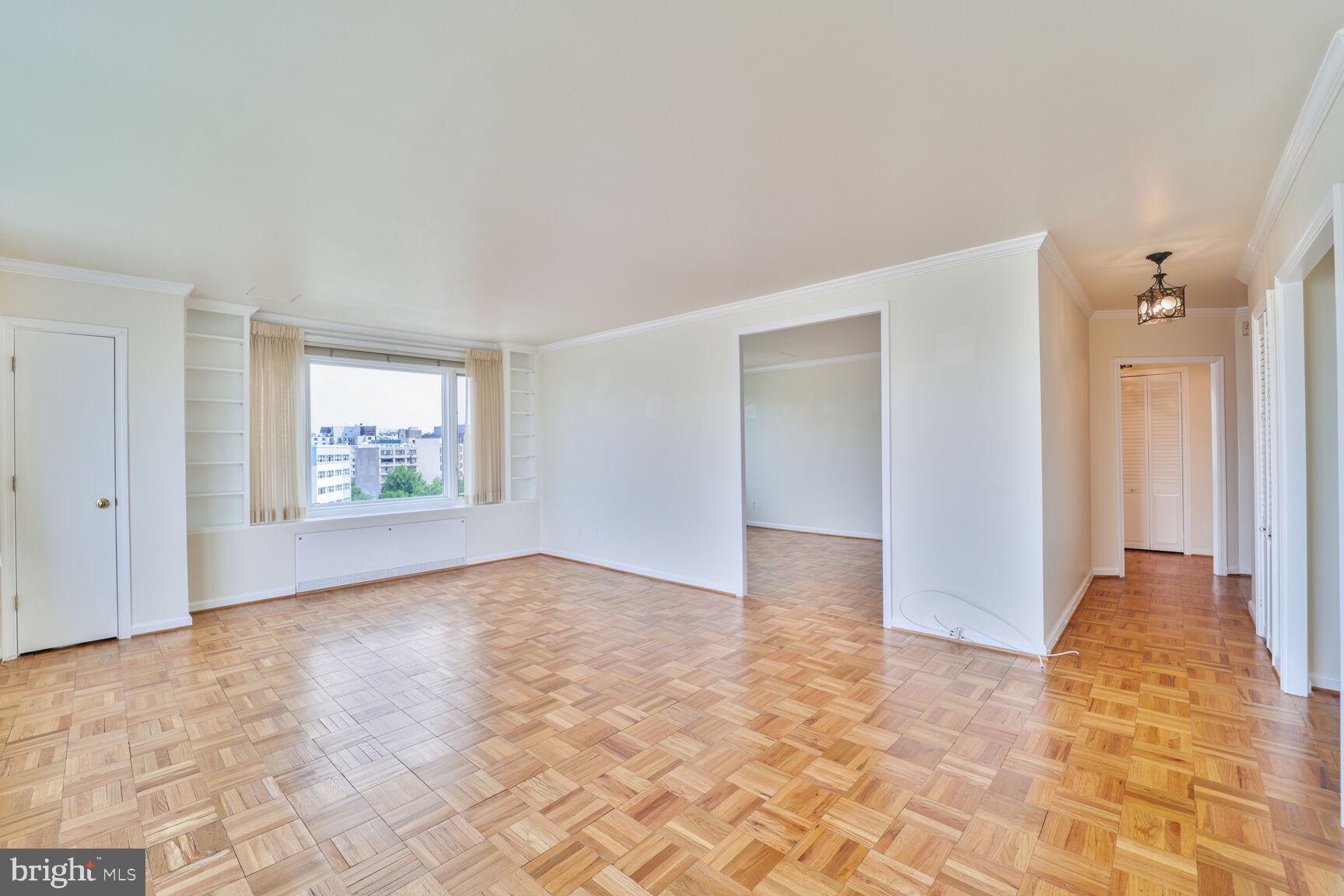 2475 Virginia Avenue Northwest, Unit 930 Washington, DC 20037 - Photo 3 of 42 a view of an empty room and window