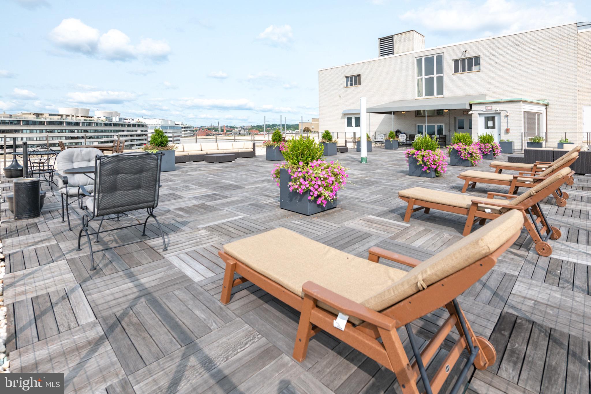 2475 Virginia Avenue Northwest, Unit 930 Washington, DC 20037 - Photo 32 of 42 a view of a patio with chairs and a table