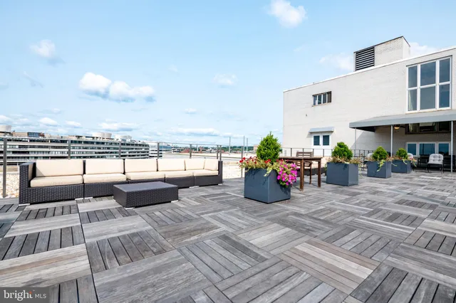 a view of a terrace with sitting area