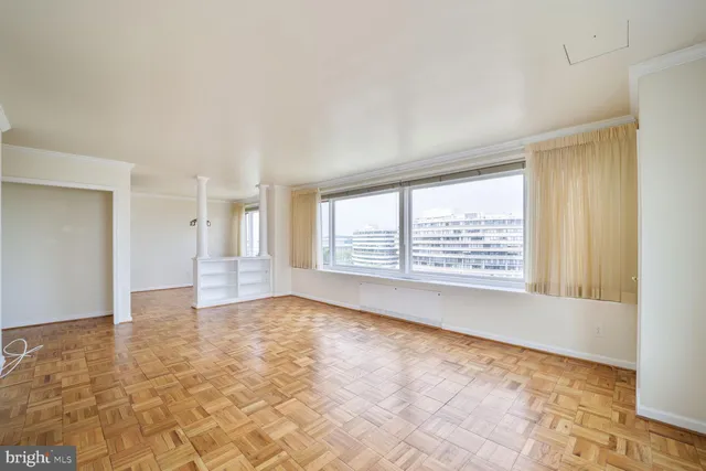 a view of an empty room with a window