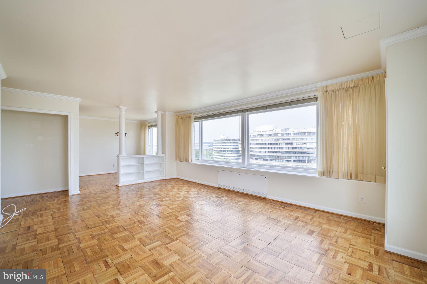 2475 Virginia Avenue Northwest, Unit 930 Washington, DC 20037 - Photo 7 of 42 a view of an empty room with a window
