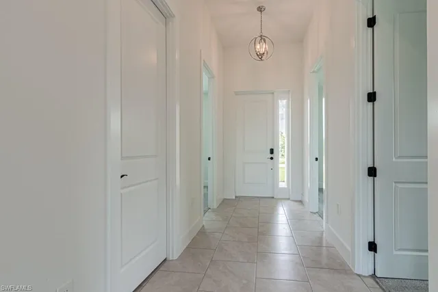 a view of a hallway with a room