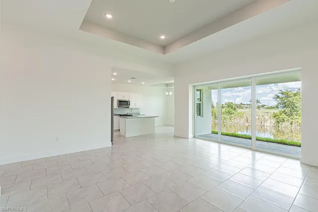 a view of a kitchen with a sink and a window
