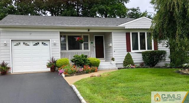 17 Brox Road Edison, NJ 08817 - Photo 1 of 11 a front view of a house with a yard and garage